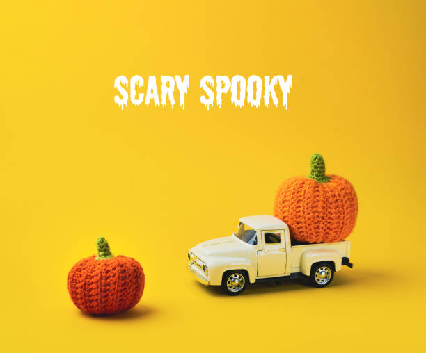 istock A white truck is carrying two orange pumpkins 2168405730