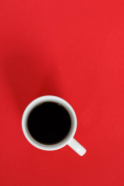 istock Cup of coffee on a red background 2168408968