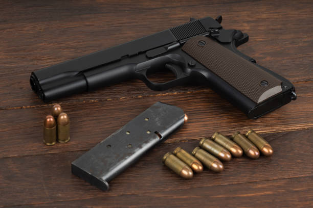 istock M1911 Automatic Pistol, Caliber .45 with magazine and ammunition 2168409975