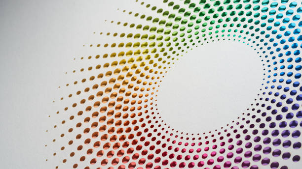 istock Colorful cut-paper artwork with a radial pattern of dots forming a gradient spectrum on a white background 2168413194