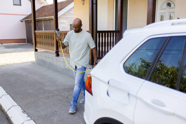 istock Latin American going to charge his electric car 2168413675