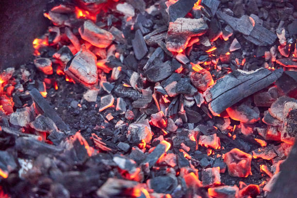 istock hot coals in a metal brazier close-up 2168413736