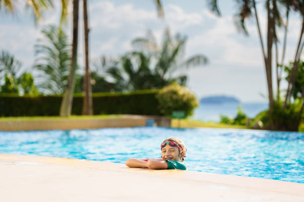 istock Kids jump into swimming pool. Summer water fun. 2168414105