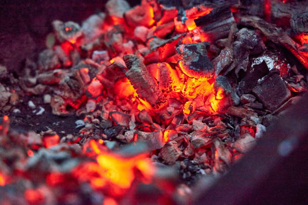 istock hot coals in a metal brazier close-up 2168414500