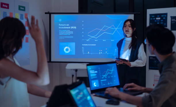 istock finan asking question when leader reviewing data during a nighttime meeting financial projections and digital reports displayed on a screen 2168415040