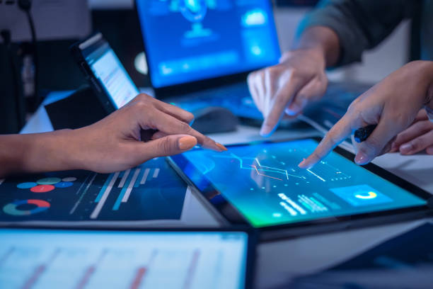 istock close up hand team of financial discussion fintech  technology planning, analyzing digital financial data and strategy in a modern office at night 2168415705