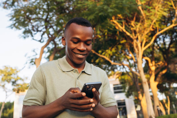 istock Young Man Enjoying Technology Outdoors 2168420840