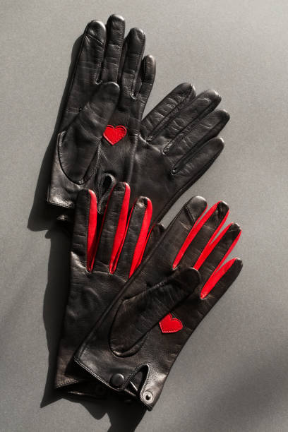 istock Two pairs of black gloves with red elements 2168425068