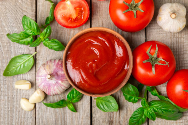 istock Fresh cherry tomatoes and fresh green basil on a textured background. Tomato sauce. Vegan. Ingredients for salad. Organic food. Place for text. Copy space. 2168428038