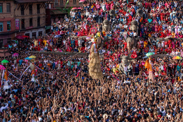 Nepalese devotees carry's the straw effigy as they take part in a procession during Gai Jatra or Cow Festival celebrated in Bhaktapur, Nepal on Tuesday, August 20, 2024. On the occasion of Gai Jatra or Cow Festival, Nepalese people celebrates by remembering decreased ones and pay tribute to the departed souls. A cow is regarded as holy by Hindus, who believe it will help the deceased relative's journey to heaven.