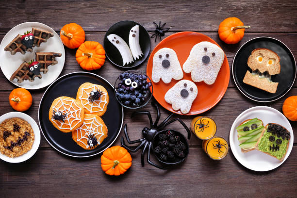 istock Spooky Halloween breakfast table scene over a dark wood background 2168430402