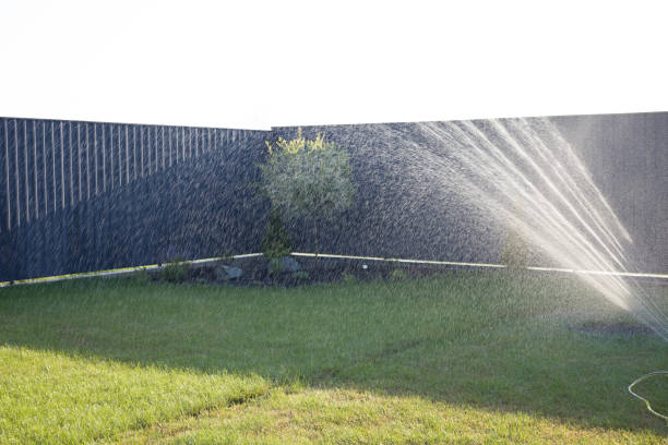 istock watering the lawn. irrigation system. landscaping 2168438315