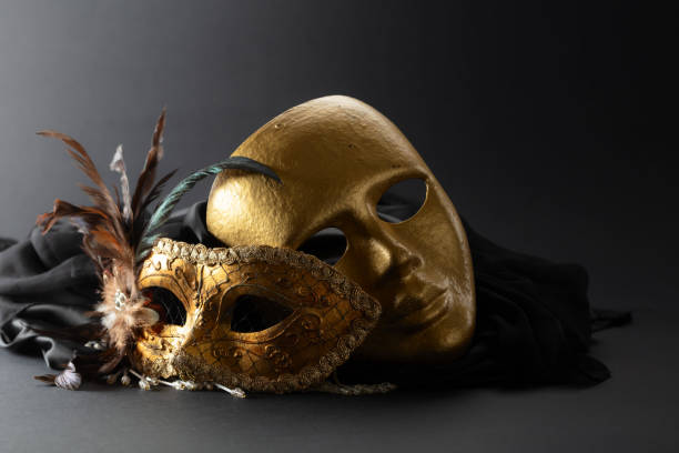istock Golden Venetian carnival masks on a black background. 2168439079