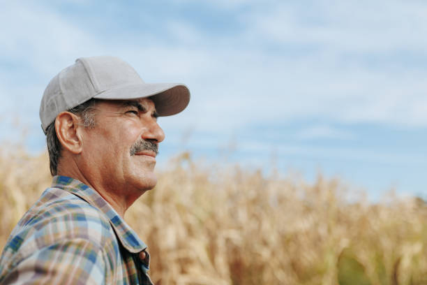 istock Senior Man with Mustache Standing on Agricultural Field 2168440173