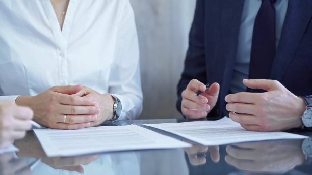 istock Diverse business people discussing contract terms before signing the agreement. Teamwork of lawyers and businesspeople 2168443340