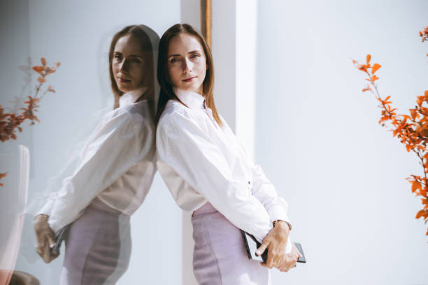 istock Woman reflected in glass window 2168444598