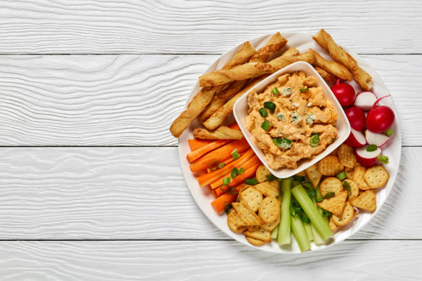 buffalo chicken dip with veggie and bread sticks