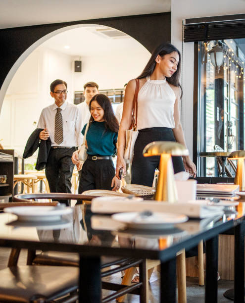 Business group arriving at restaurant for dinner after work