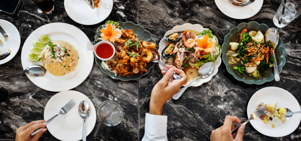 Top view of diners enjoying a variety of Thai dishes at a restaurant