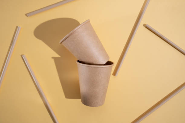 istock Kraft paper tableware: cups, food boxes, isolated on a light background. A set of various disposable tableware. Recycling and zero waste concept. Mock up 2168449549