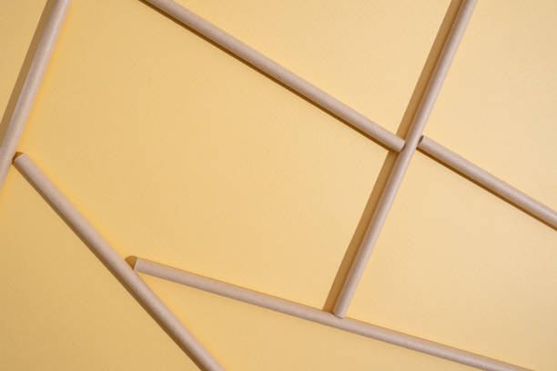 istock Kraft paper drinking straw for summer cocktails on a light background with copy space. View from above 2168449562