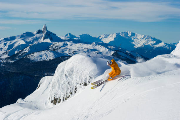 istock Man skis steep slope at ski resort 2168450114