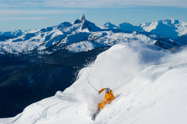 istock Man skis steep slope at ski resort 2168450115