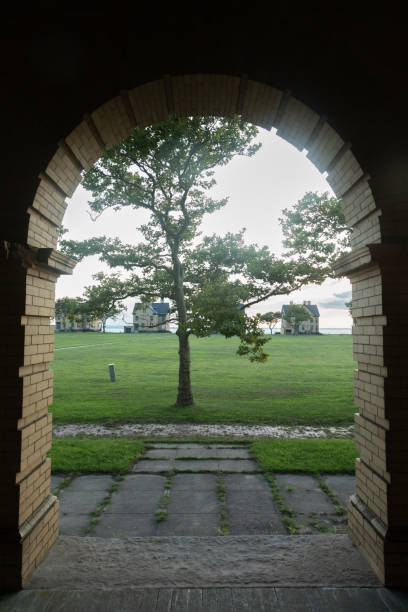 A beautiful sunset is captured surrounding the historic architecture of the buildings at Fort Hancock in Sandy Hook, New Jersey. Photo taken in August of 2024.