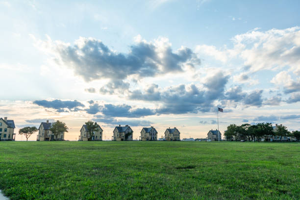 A beautiful sunset is captured surrounding the historic architecture of the buildings at Fort Hancock in Sandy Hook, New Jersey. Photo taken in August of 2024.