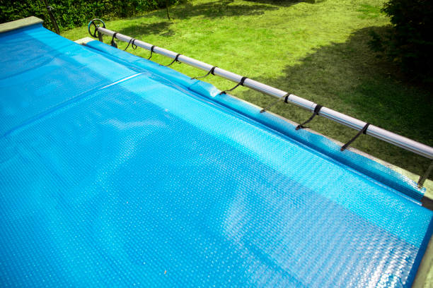 istock Part of a swimming pool covered with a solar mat 2168457429