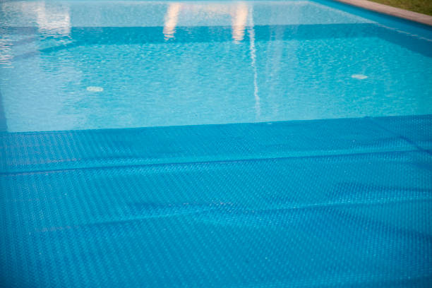 istock Inflatable Blue thermal pool cover for swimming pool water 2168457437