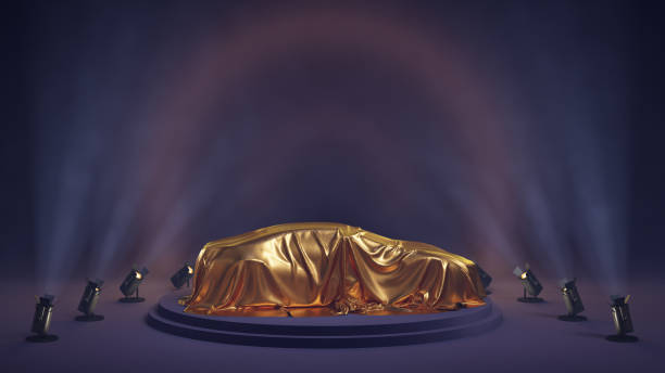 istock Car covered with golden cloth on exhibition show 2168458445