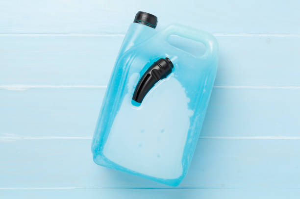 istock Can with antifreeze on wooden background, top view 2168461651