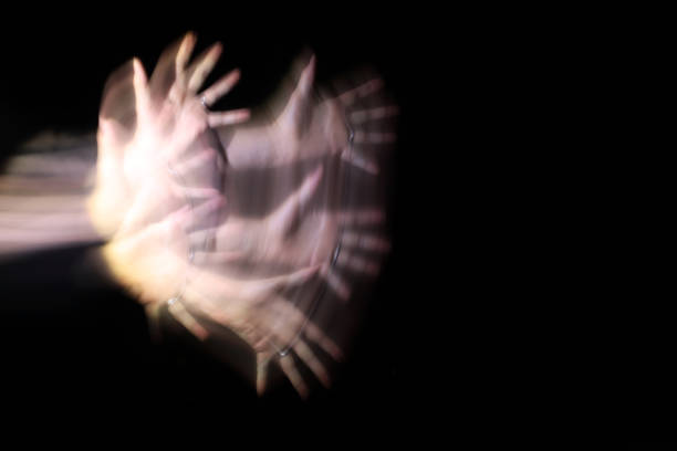 Long exposure of a woman's hand at night