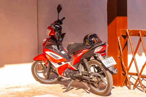 Closeup modern motorcycle wheel, with brake disc background with copy space, full frame horizontal composition