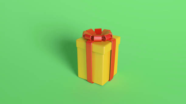 istock Yellow Gift Box with Red Ribbon on Green Background 2168469215