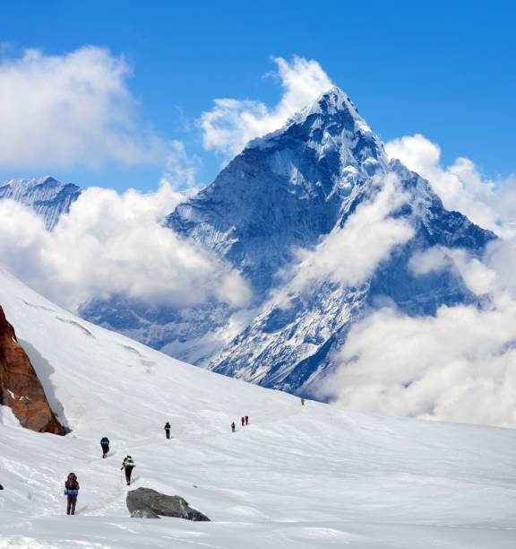 istock hikers on glacier and mount Ama Dablam 2168475023