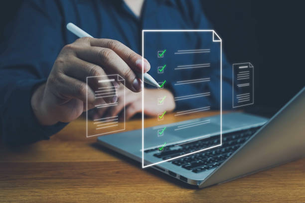 istock Businessman marks checkboxes. The survey form, check marks on a checklist, fill out online form, and answer questions. List options for business security procedures followed office. Checklist concept. 2168478285