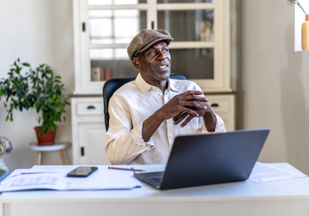 istock Entrepreneur sitting at his business desk 2168479788
