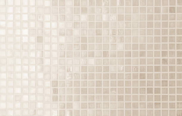 istock Cream light ceramic wall and floor tiles mosaic background in bathroom and kitchen. Design pattern geometric with grid wallpaper texture decoration pool. Simple seamless abstract surface clean. 2168481286