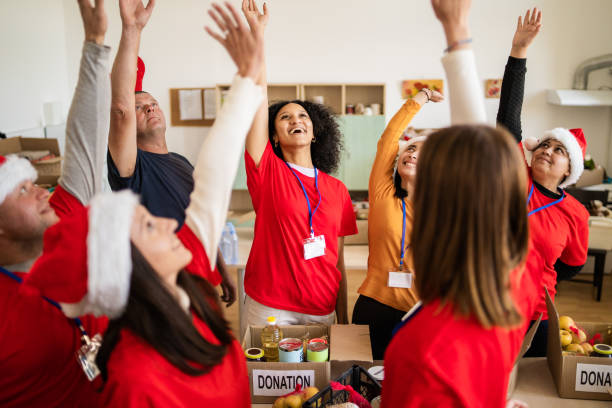 istock A happy team high five over a box of groceries 2168483207