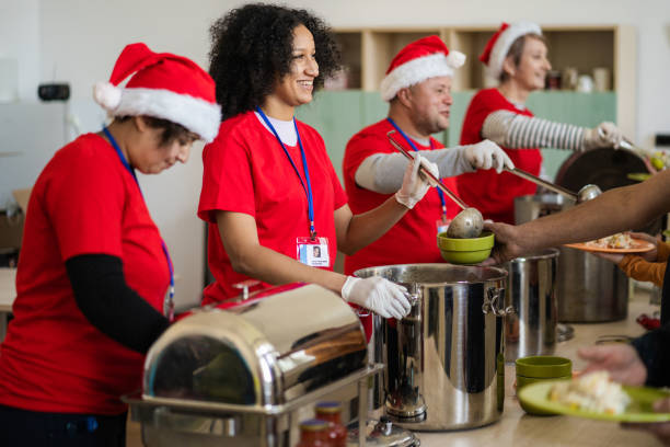 istock Volunteers ready to serve in a soup kitchen 2168483215