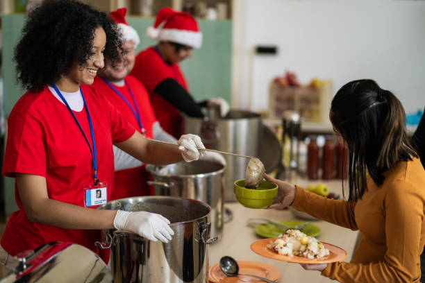istock A hungry woman is being served in a soup kitchen 2168483221