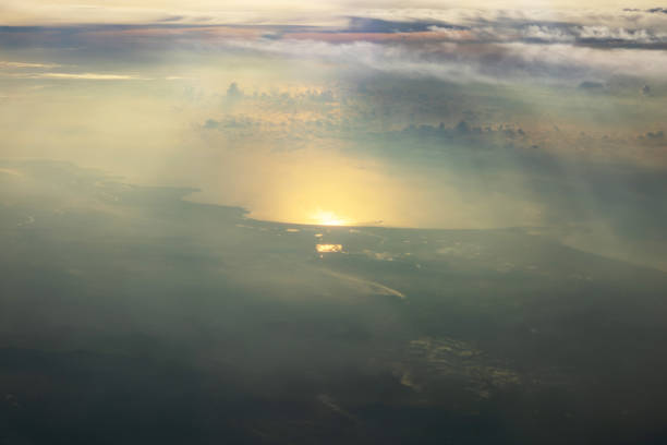 istock Golden Sunrise Over Expansive Landscape with Clouds and Horizon 2168483417