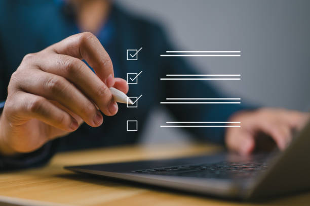 istock Businessman tick correct sign mark for document approve , project acceptance and quality assurance concept, Take an assessment, questionnaire, evaluation, online survey online exam. 2168487338