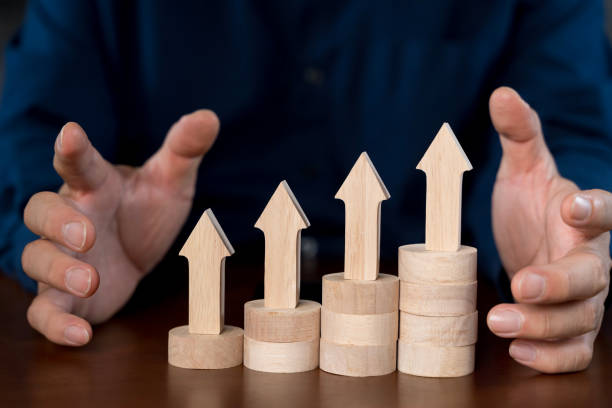 istock A hand is putting blocks together to form a staircase. Business concept growth success process. 2168488991