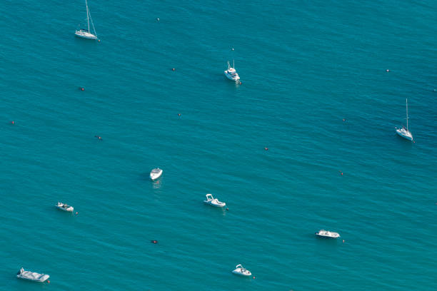 Lisbon, Portugal - September 15, 2022: A close view from the Portinho da Arrábida of the boats near the coast.