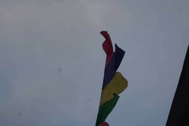 istock The flag that flies in the dark sky because it might rain 2168493464