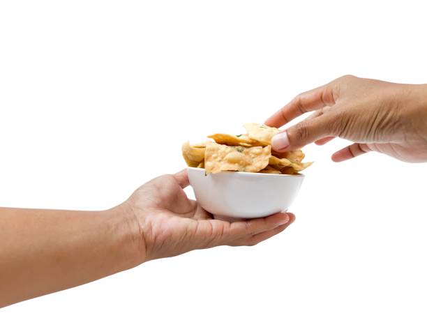 istock Keripik bawang, keripik pangsit or crispy fried dumpling, popular savoury snack in Indonesia, made oF flour, butter, salt and spring onion. usually as 2168499521