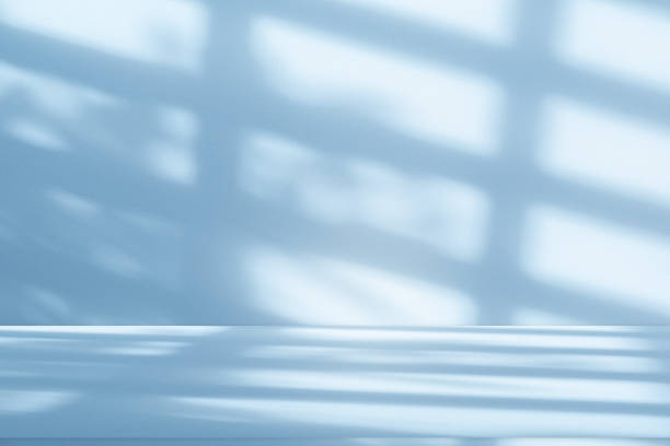 istock Studio style background wall decoration presentation uses white and blue tones. with shadows cast from a nearby window, concept creating a decorative 2168502093